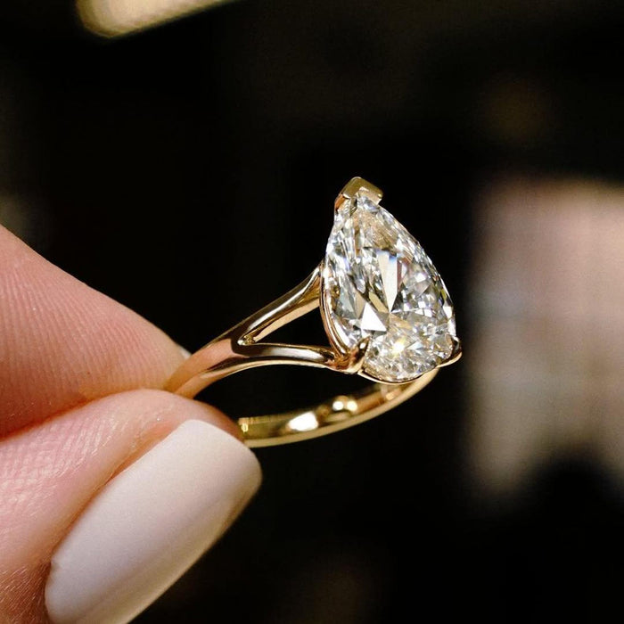 Split shank pear cut diamond ring showing the two strands framing the centre stone