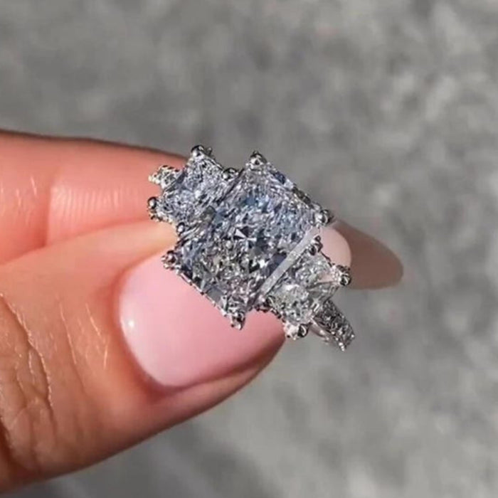 Three matching radiant cut lab grown diamonds set in a line