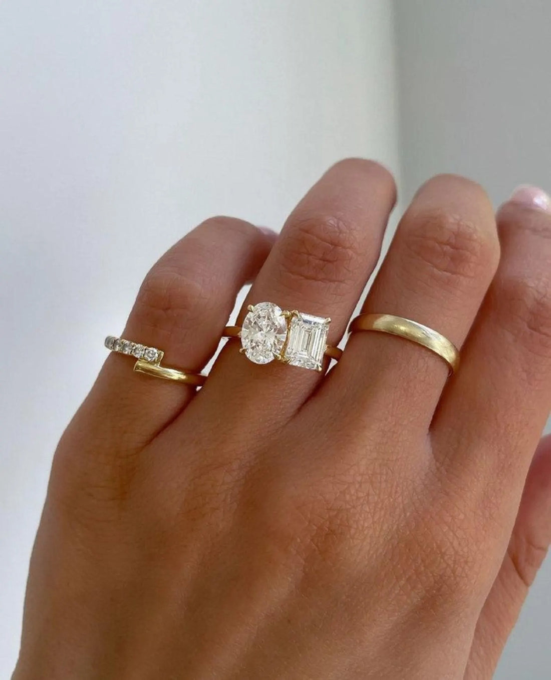 Toi et moi oval and emerald cut lab grown diamond engagement ring in yellow gold