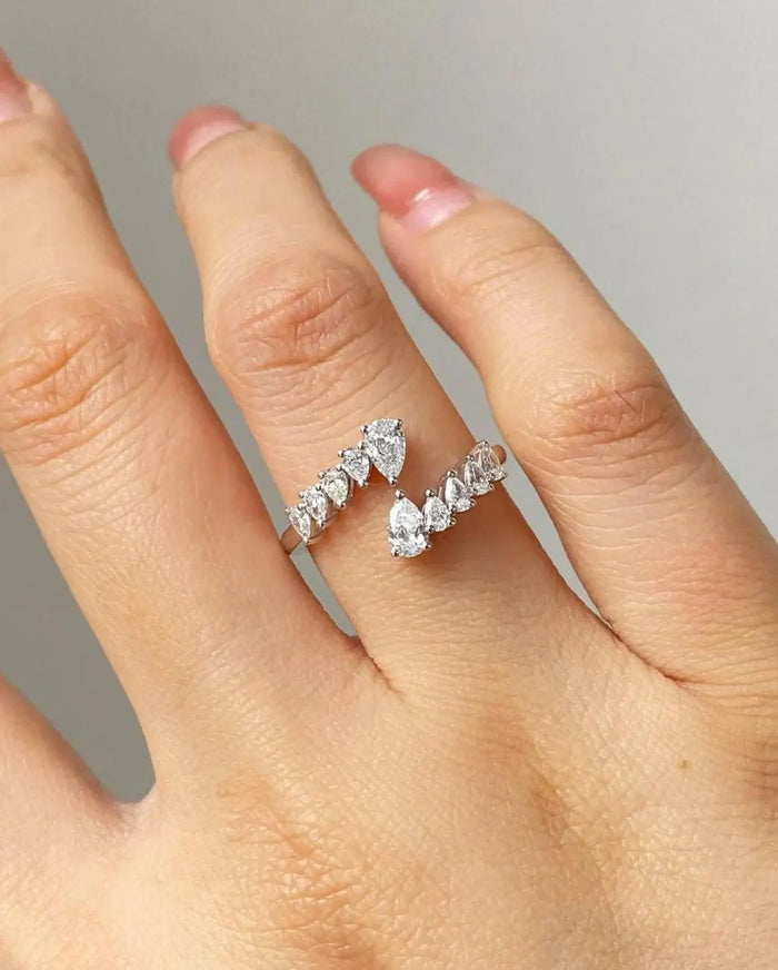 Open bypass pear cut lab grown diamond ring with graduated accents in white gold