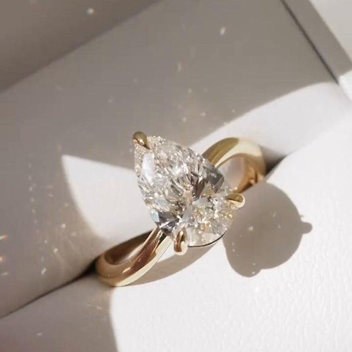 Pear cut lab grown diamond solitaire ring angled view