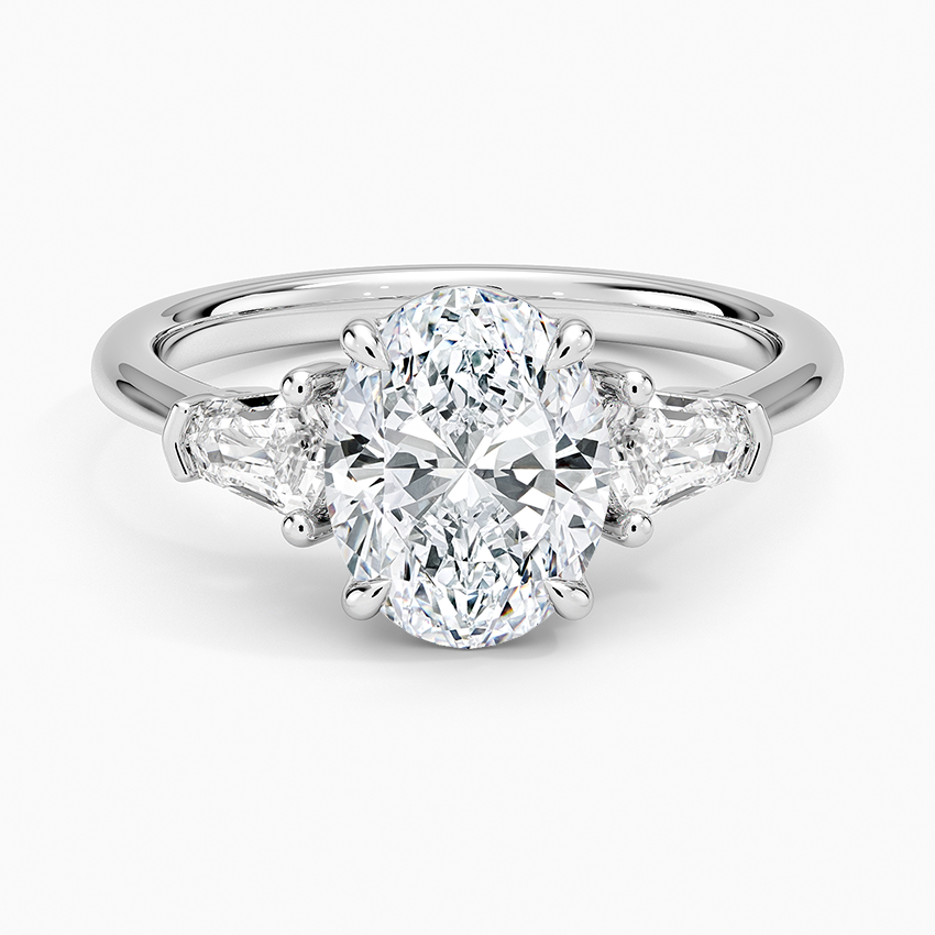 Oval cut lab grown diamond three stone ring with bullet cut side stones in white gold, top view