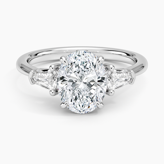 Oval cut lab grown diamond three stone ring with bullet cut side stones in white gold, top view