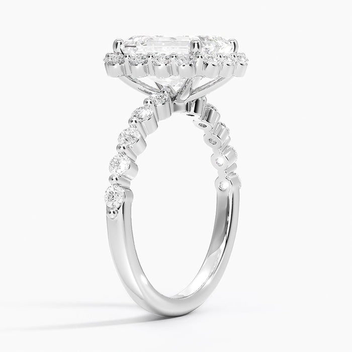 Side profile showing the open halo and graduated shared prong diamond shoulders