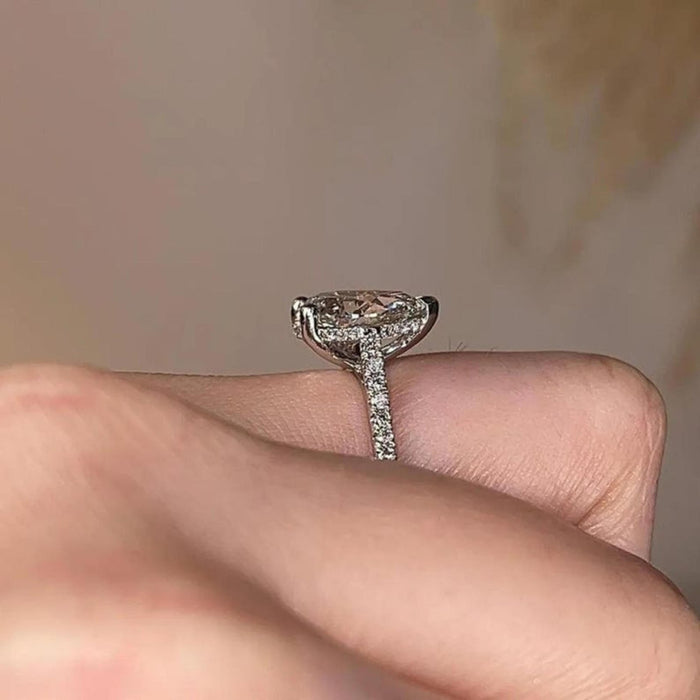 Pear cut lab grown diamond claw prong ring with hidden halo