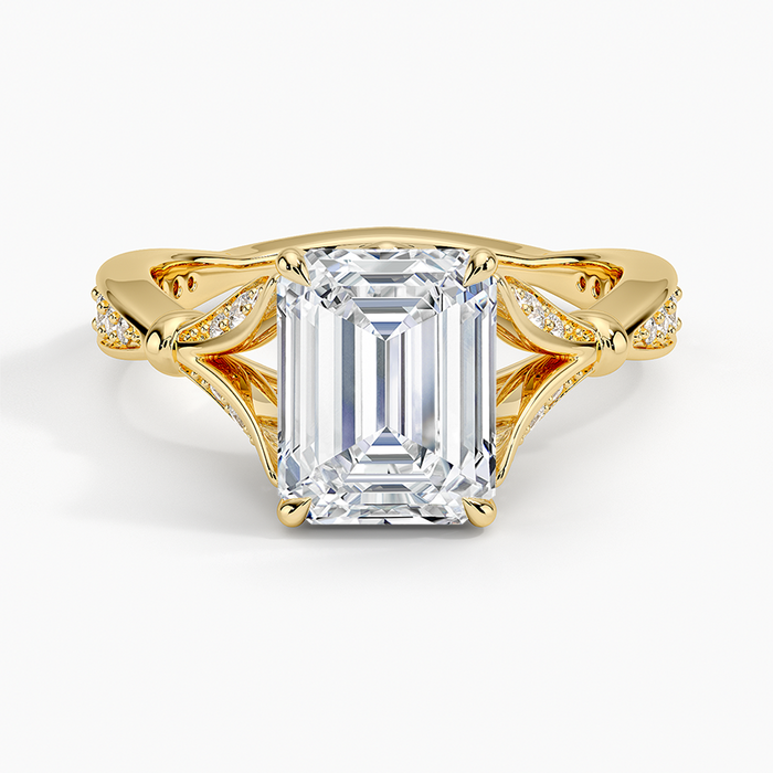 Emerald cut lab grown diamond ring with sculpted pave leaf petal shoulders in yellow gold, top view