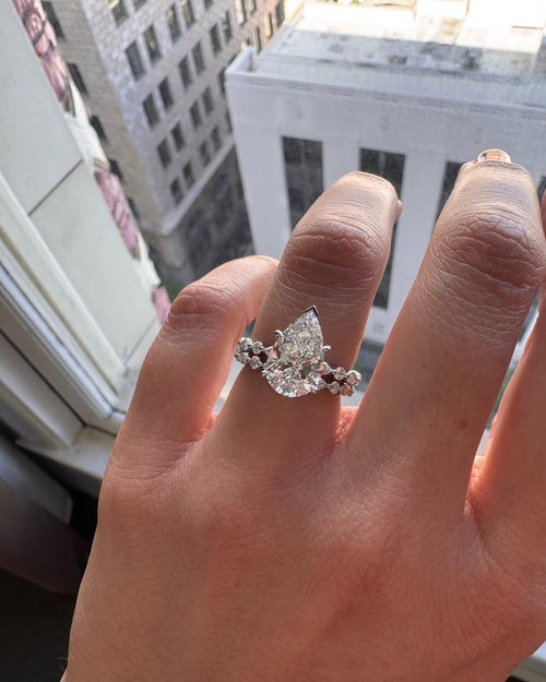 Pear cut lab grown diamond bridal ring set with a contoured marquise and round wedding band in white gold