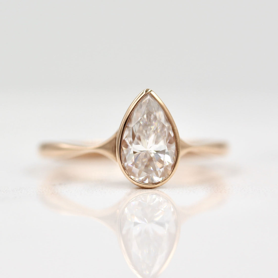 Pear lab grown diamond bezel solitaire engagement ring
