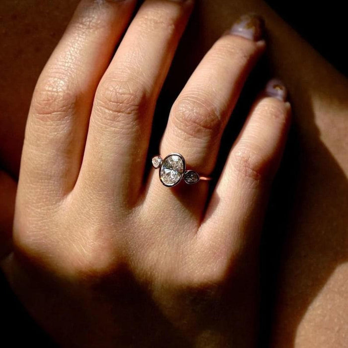 Art deco oval three stone lab grown diamond ring angled view