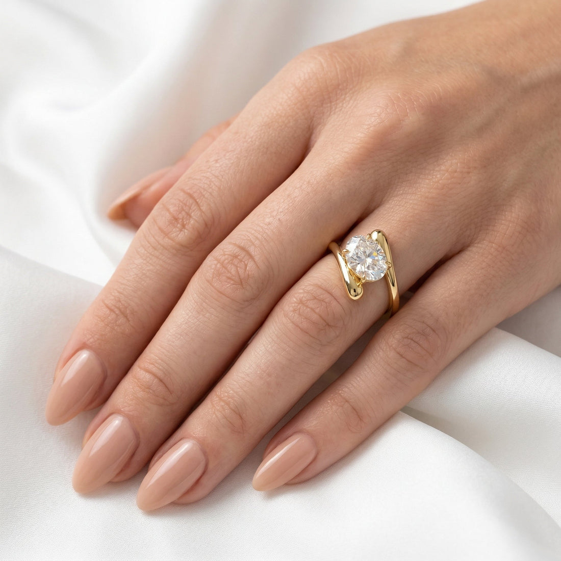 Oval lab grown diamond bypass swirl engagement ring