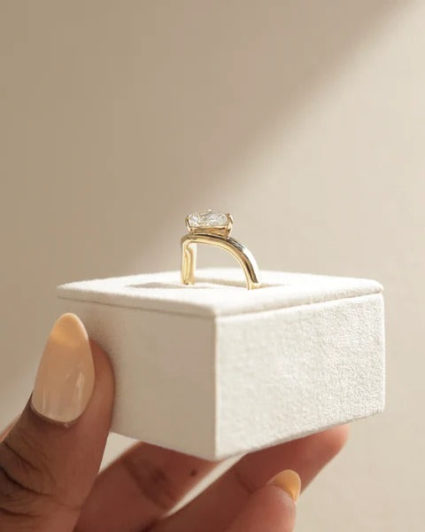 Pear cut diamond solitaire ring with twist band