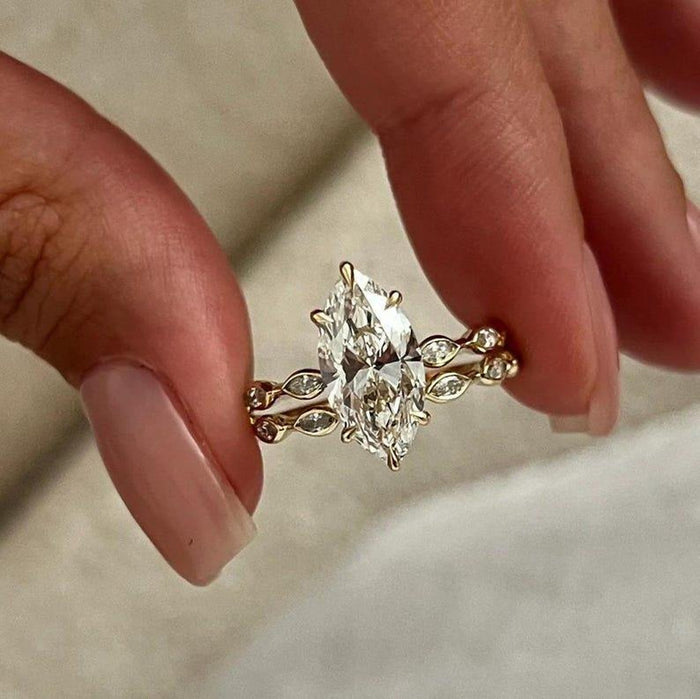 Marquise shaped accents laid end to end along the wedding band