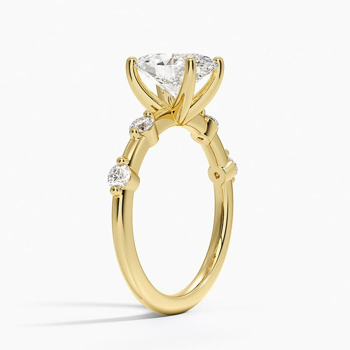Profile view showing the graduated accents held between shared prongs with plain metal gaps