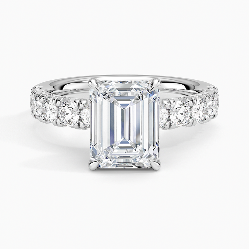 Emerald cut lab grown diamond ring in white gold with large shared prong diamonds along the shoulders, top view
