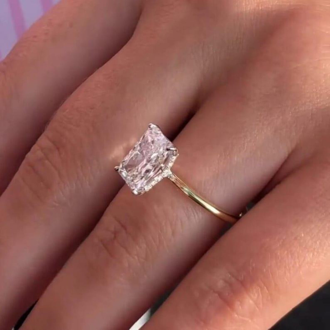 Radiant cut lab grown diamond hidden halo solitaire ring in yellow gold