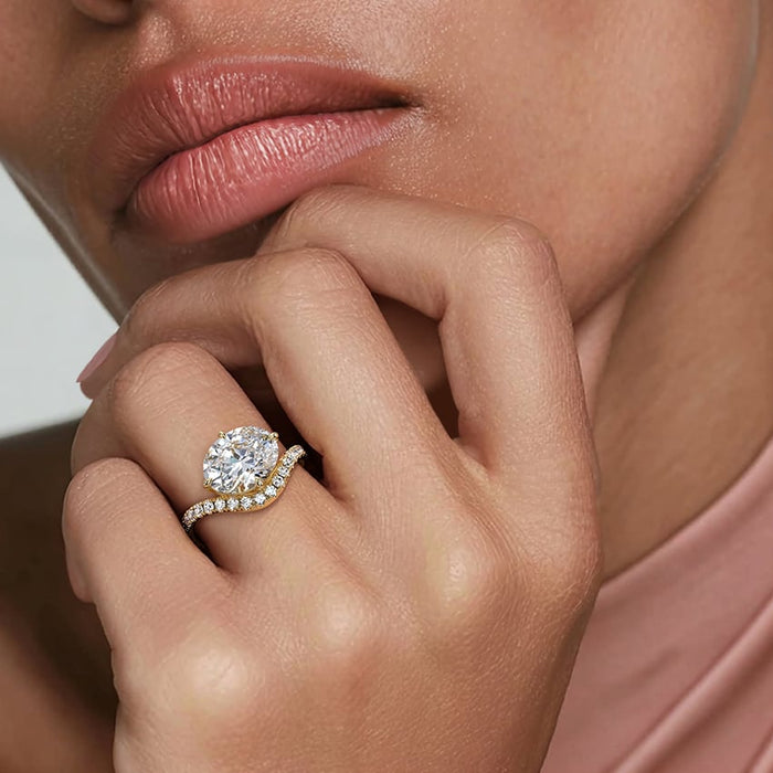 Model wearing the east west oval lab grown diamond chevron pave ring