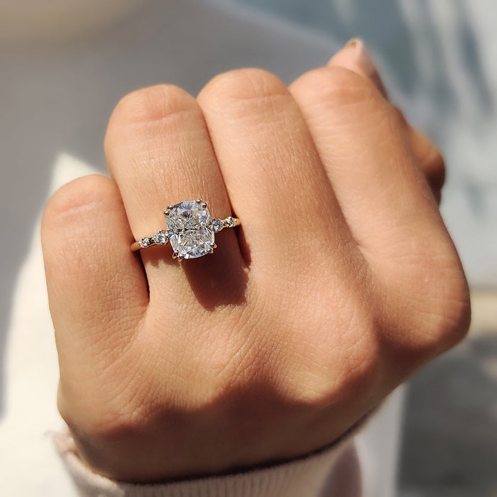 Elongated cushion diamond above pave set shoulders