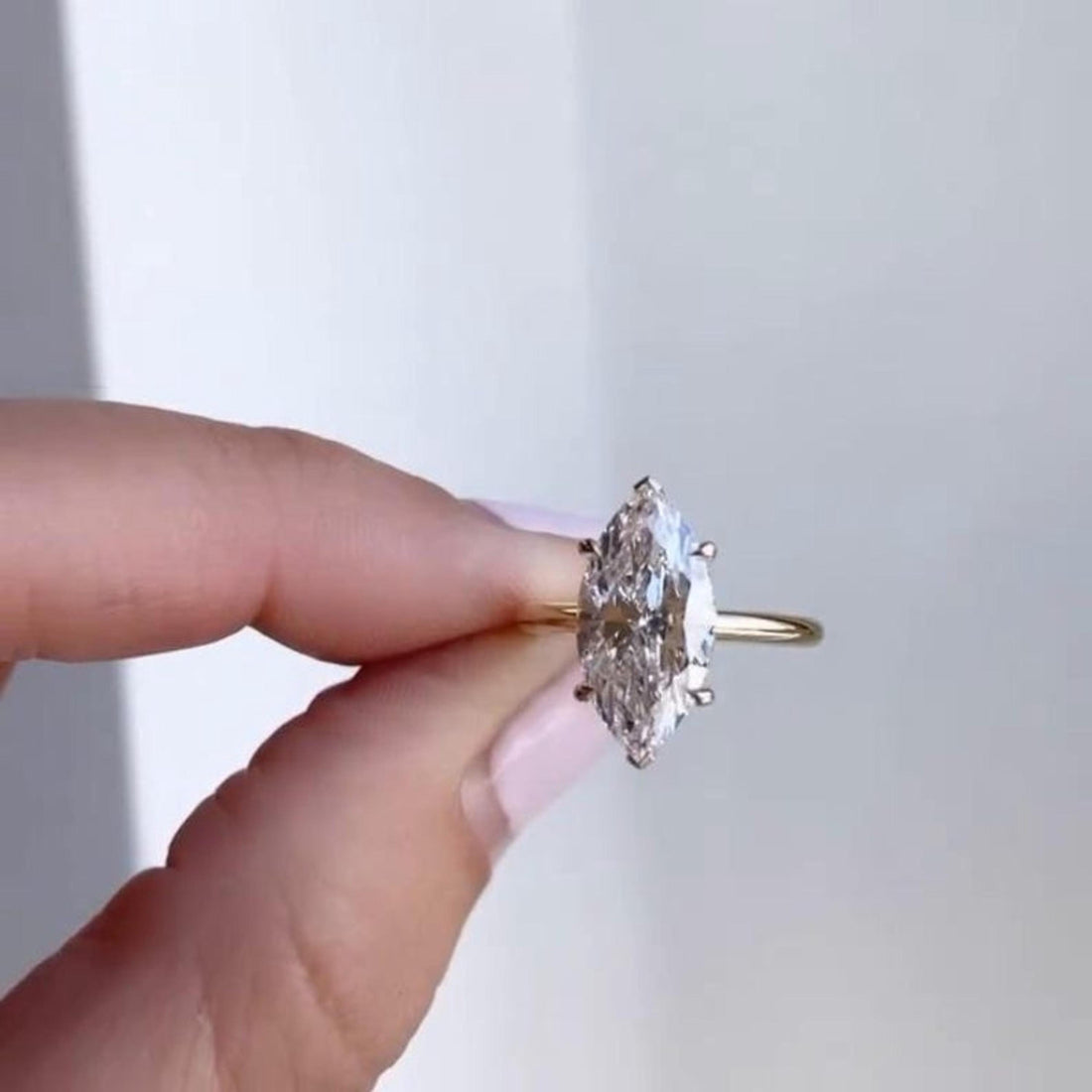 Marquise cut lab grown diamond hidden halo ring with plain band