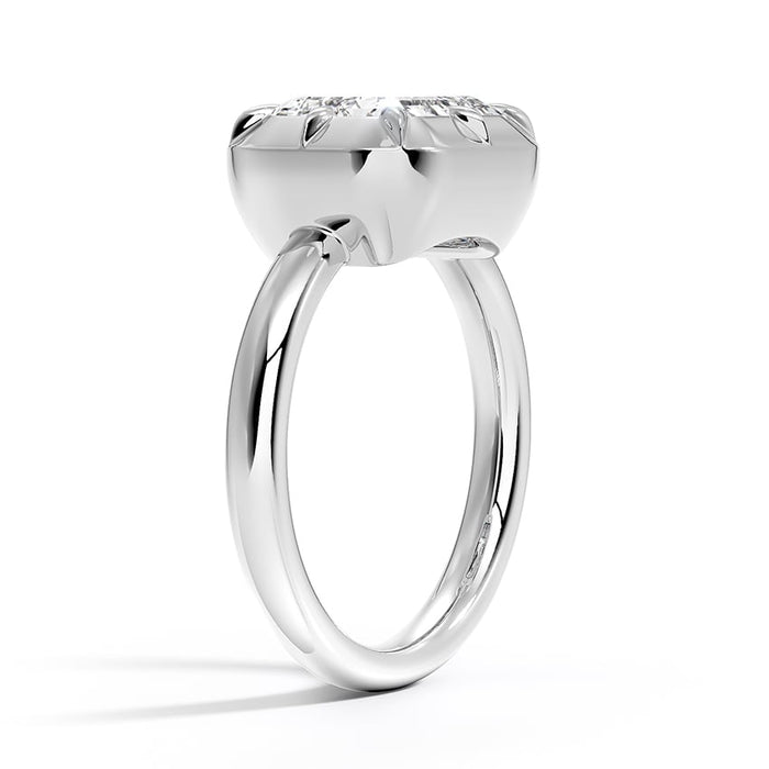 Profile view showing the solid polished dome and the forked wire shank joining it from beneath