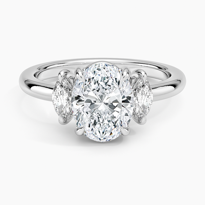 Oval cut lab grown diamond three stone ring with upright marquise side stones in white gold, top view