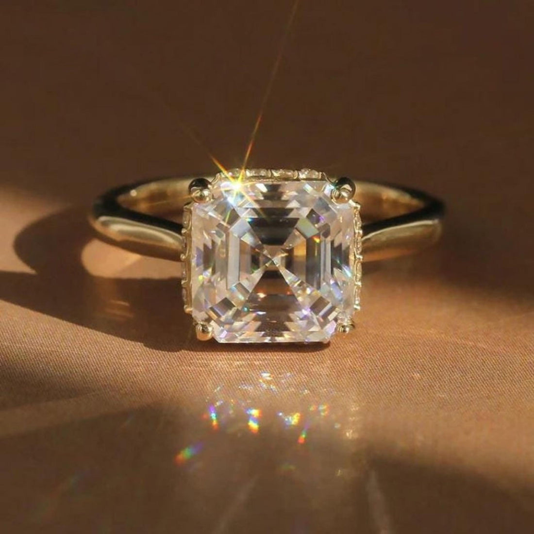 Hidden halo of round diamonds beneath the Asscher cut centre stone