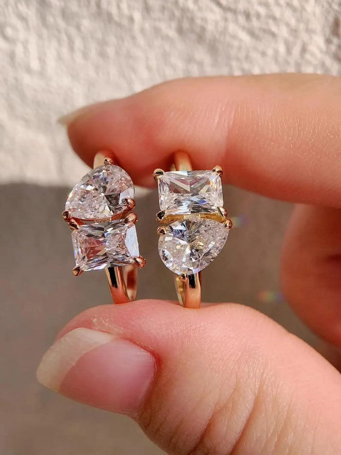 Two stone toi et moi ring with pear and radiant cut diamonds