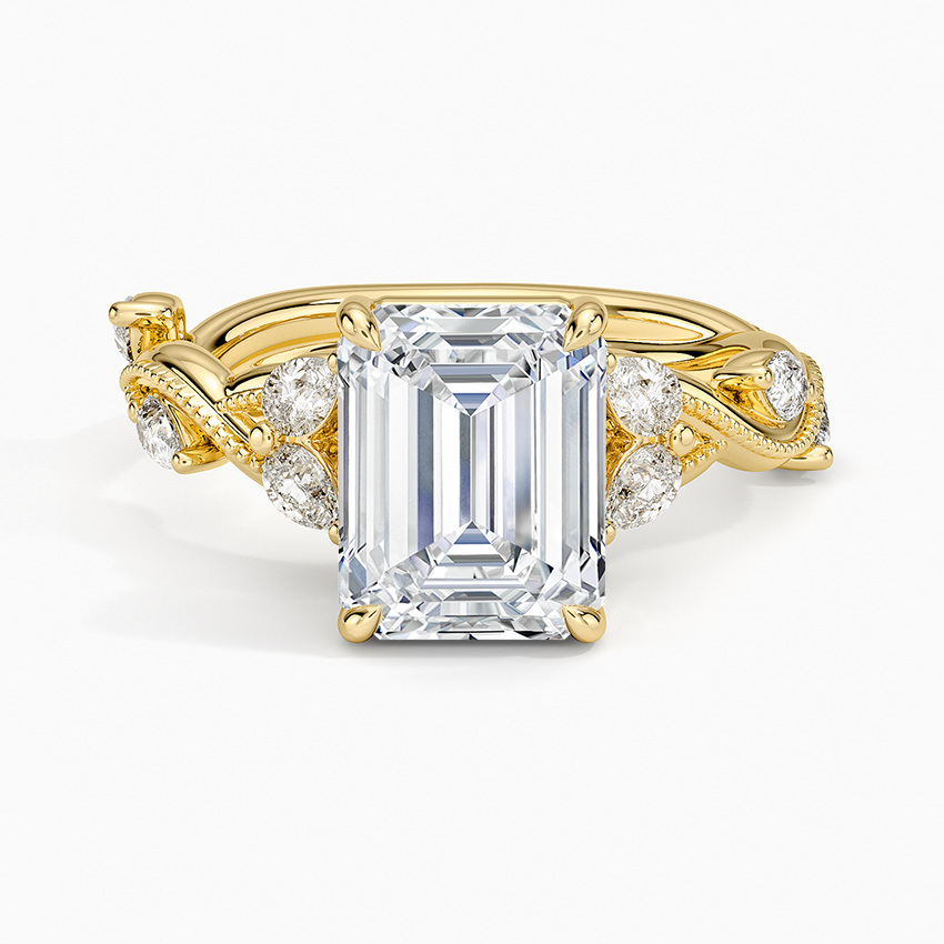 Emerald cut lab grown diamond ring in yellow gold on a milgrain vine band with pear leaf accents, top view