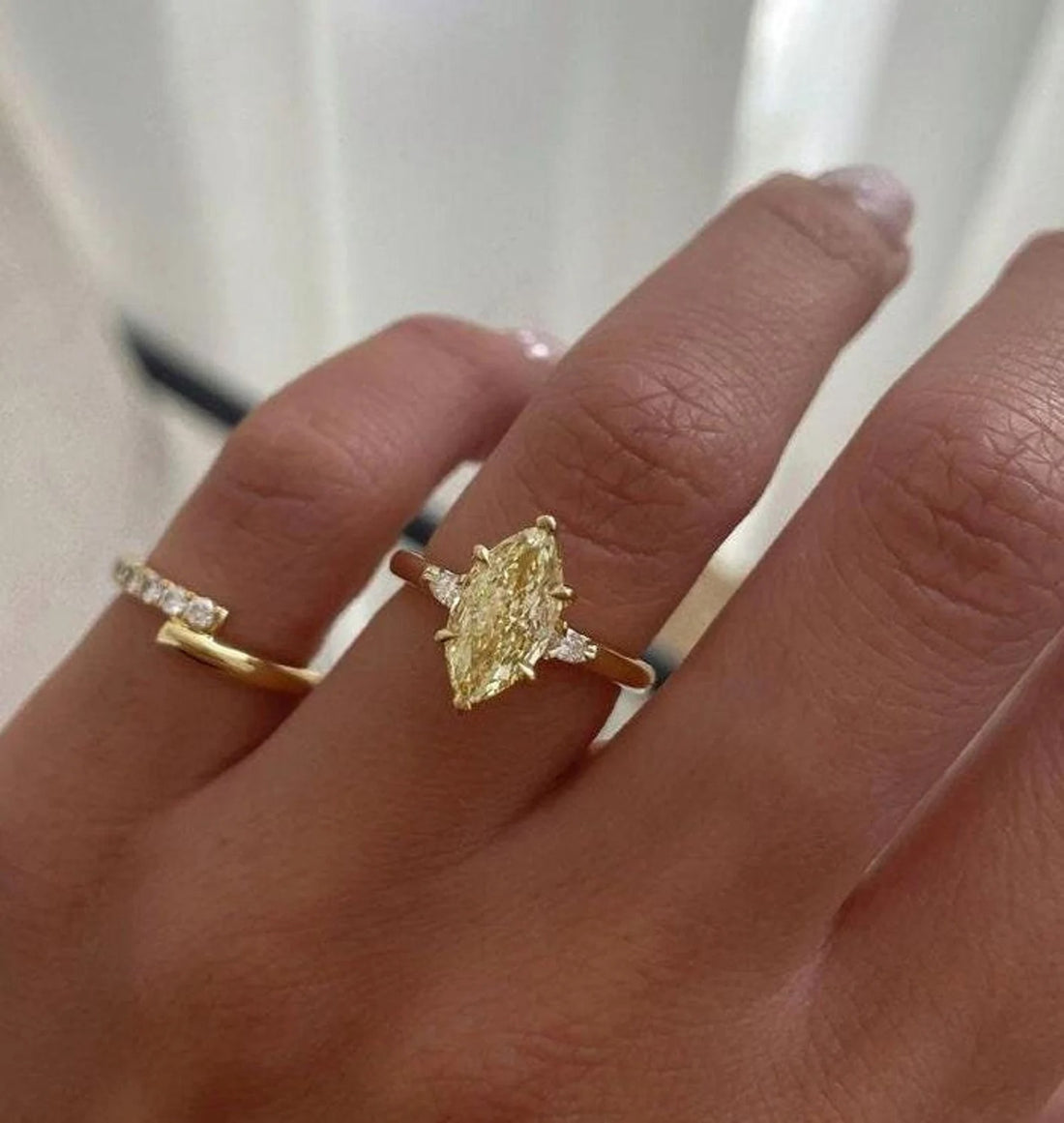 Marquise and baguette three stone ring, angled view