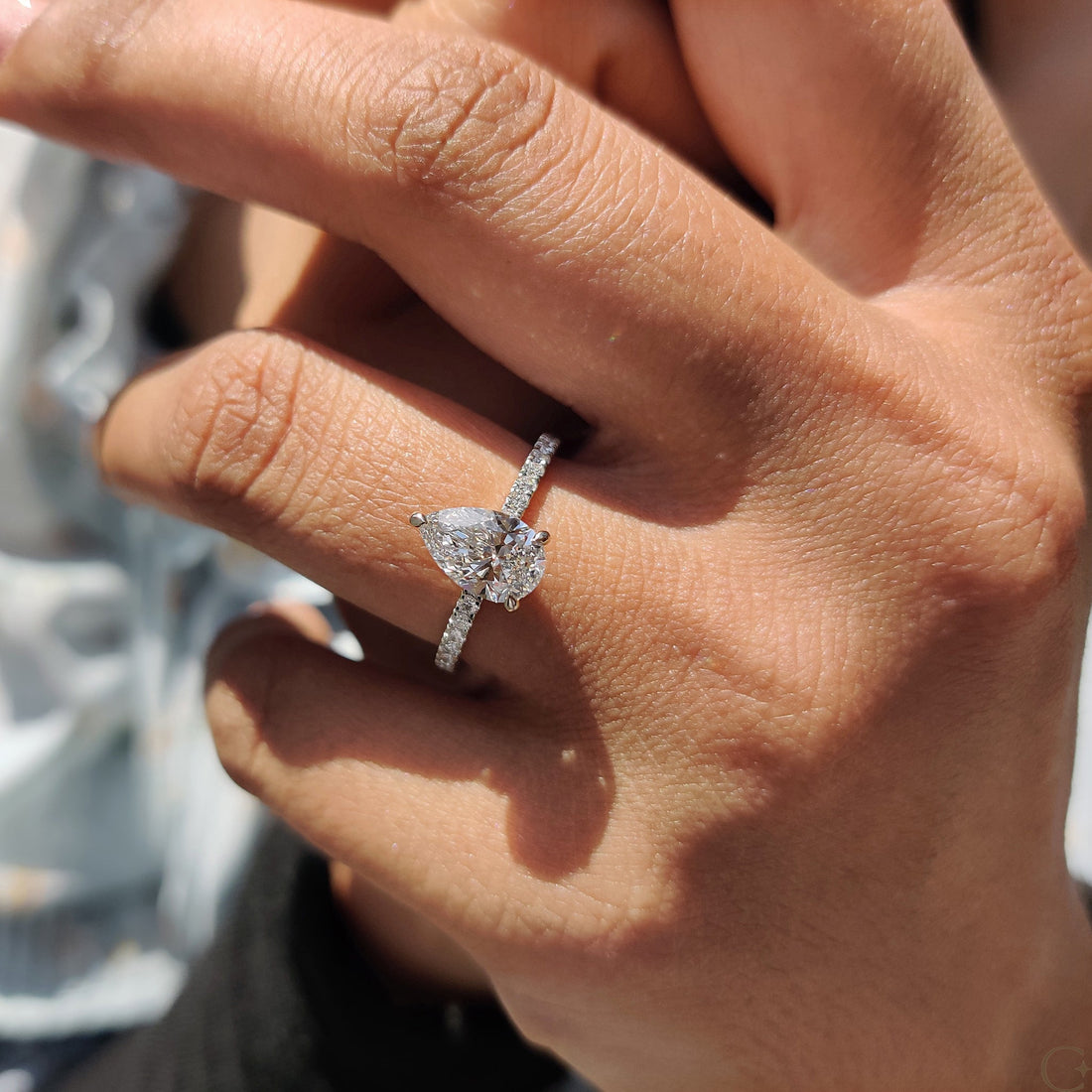 Pear cut lab grown diamond hidden halo and pave engagement ring