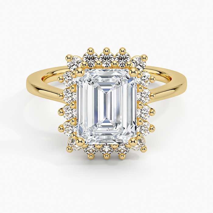 Emerald cut lab grown diamond ring in yellow gold with beaded prong sunburst halo, top view