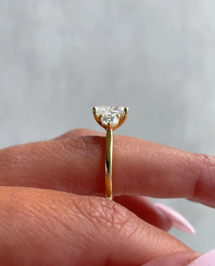 Profile of the cushion cut three stone engagement ring
