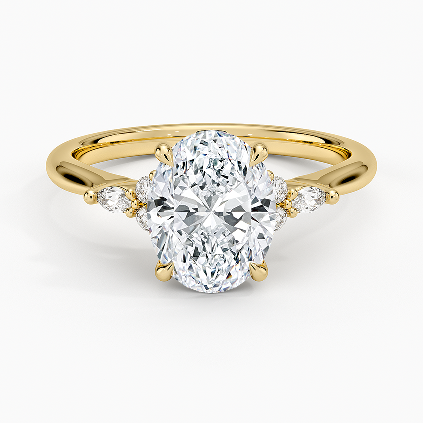Oval cut lab grown diamond ring with marquise and round accent clusters in yellow gold, top view