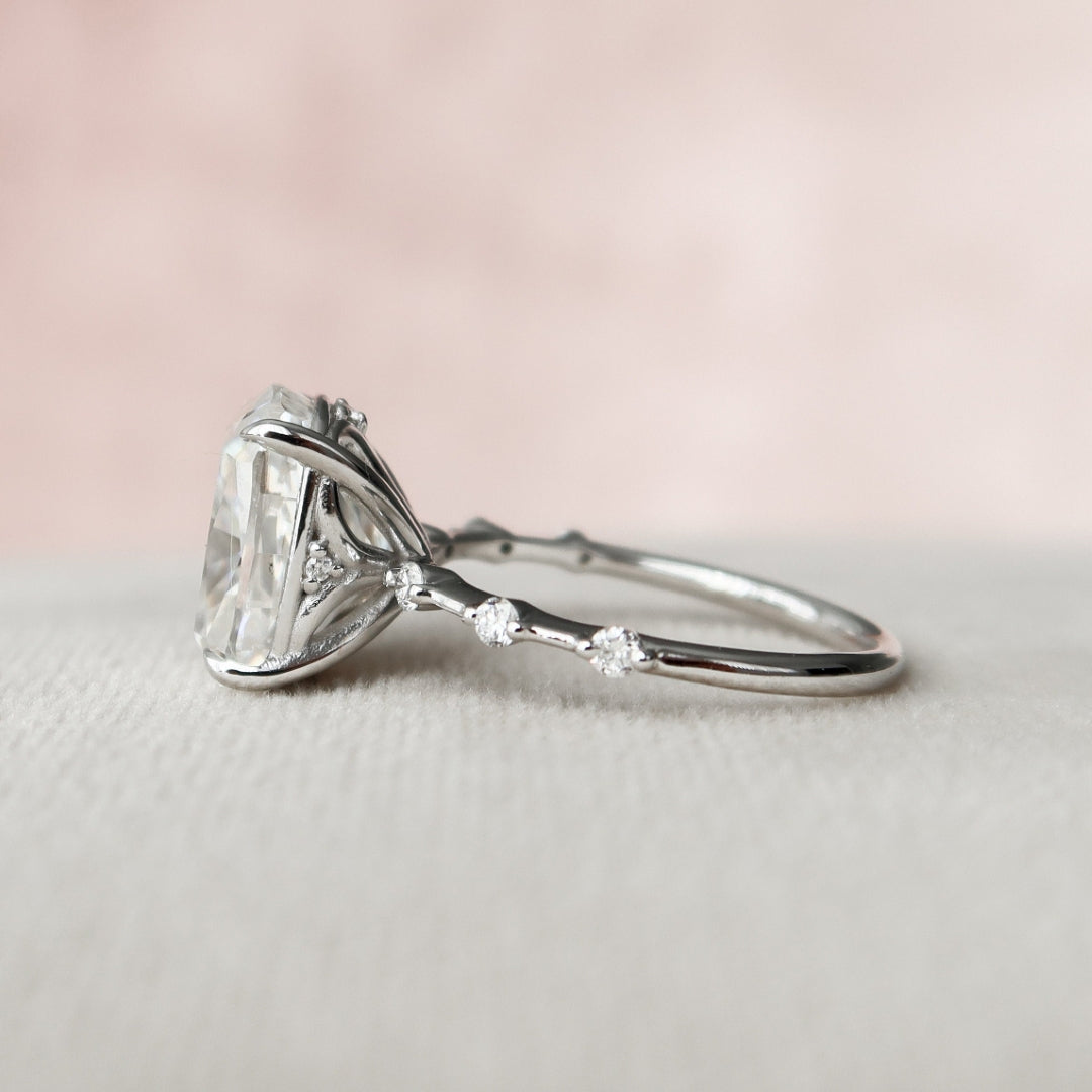 Cushion cut lab grown diamond ring with a diamond set gallery on a station band