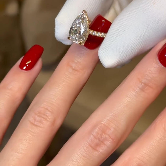 Yellow gold pear cut lab grown diamond ring angled view