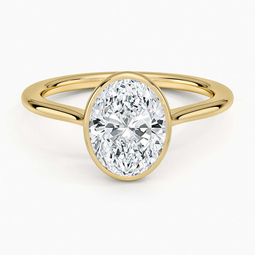 Oval cut lab grown diamond ring in a rolled edge bezel on a fine wire band in yellow gold, top view