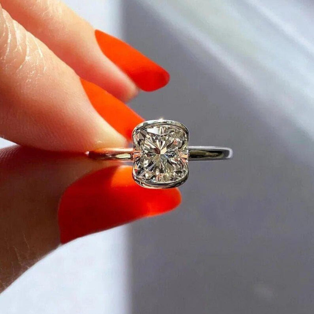 Cushion cut lab grown diamond half bezel engagement ring