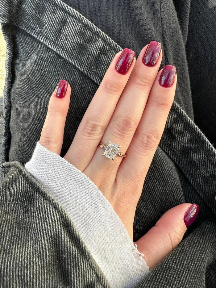 Emerald cut lab grown diamond on a twisted vine band, front view