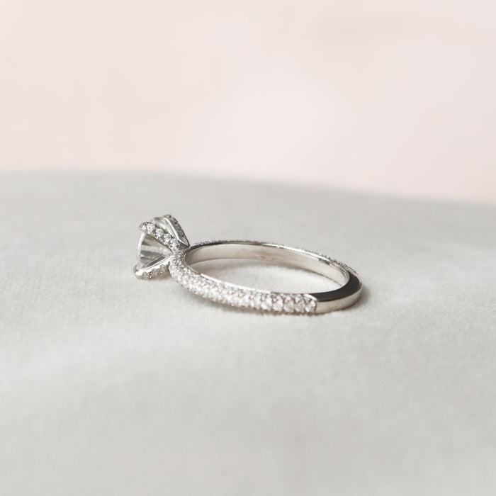Round brilliant lab grown diamond engagement ring four claw setting close up