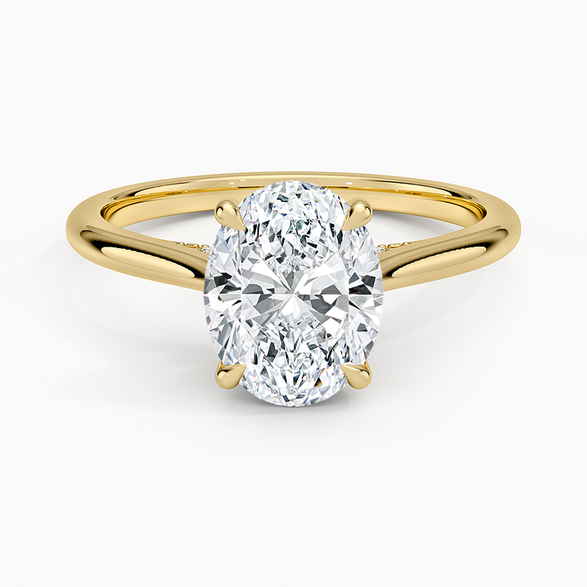 Oval cut lab grown diamond ring with hidden halo on a split cathedral yellow gold shank, top view