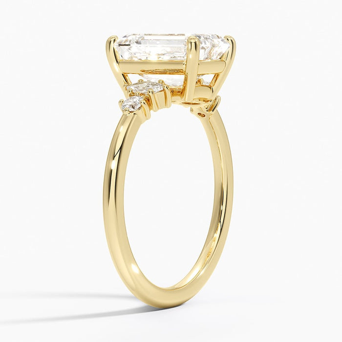 Side profile showing the claw set marquise and round accents on a slim polished band