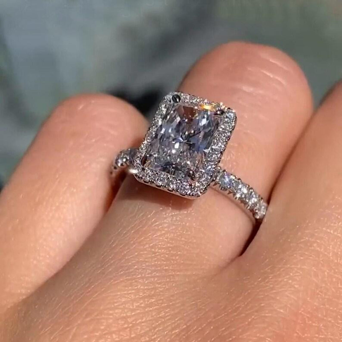 Vintage radiant cut lab grown diamond halo engagement ring with pave band
