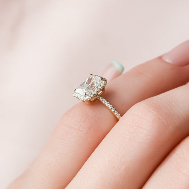 Radiant cut lab grown diamond surrounded by a close set diamond halo