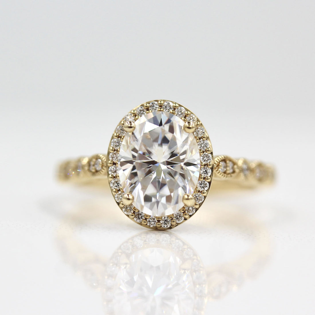 Oval lab grown diamond beaded halo heirloom engagement ring