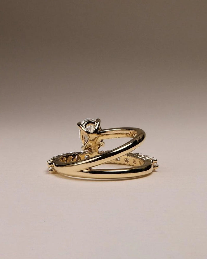 Oval solitaire engagement ring and matching pave band shown together