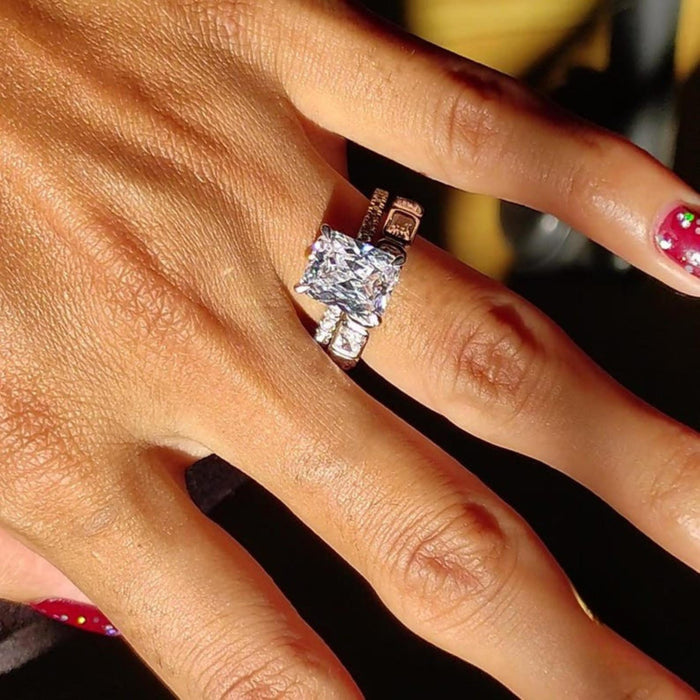 Radiant cut lab grown diamond bridal ring set with hidden halo and full bezel eternity band