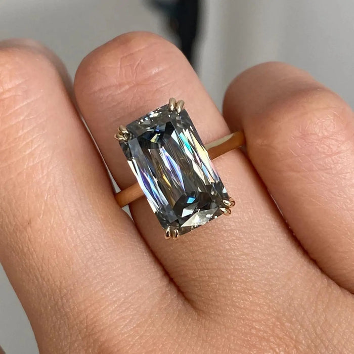 Elongated radiant cut lab grown diamond solitaire engagement ring in yellow gold