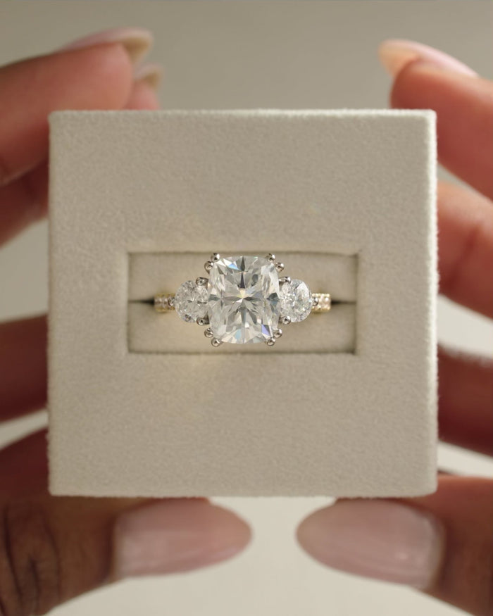Elongated Cushion Cut Moissanite Three Stone Engagement Ring with Oval Side Stones - view 1