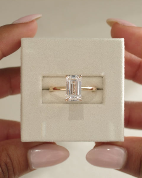 Elegant Emerald Cut Moissanite Four Prong Solitaire Engagement Ring with Fine Polished Band - view 1