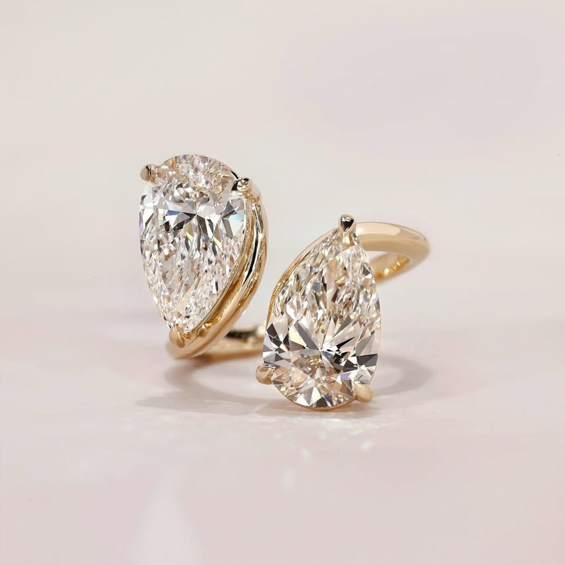 Double pear cut Toi Et Moi moissanite ring in gold