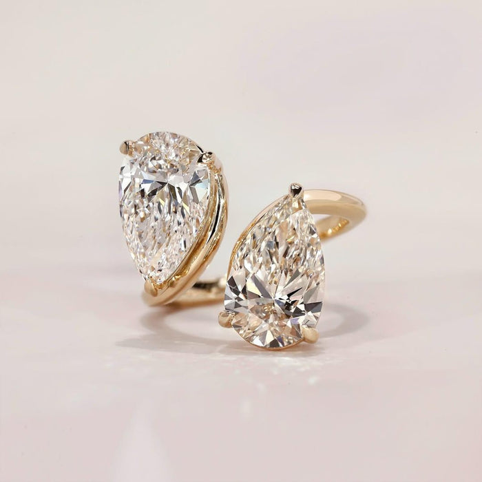 Double pear cut Toi Et Moi moissanite ring in gold